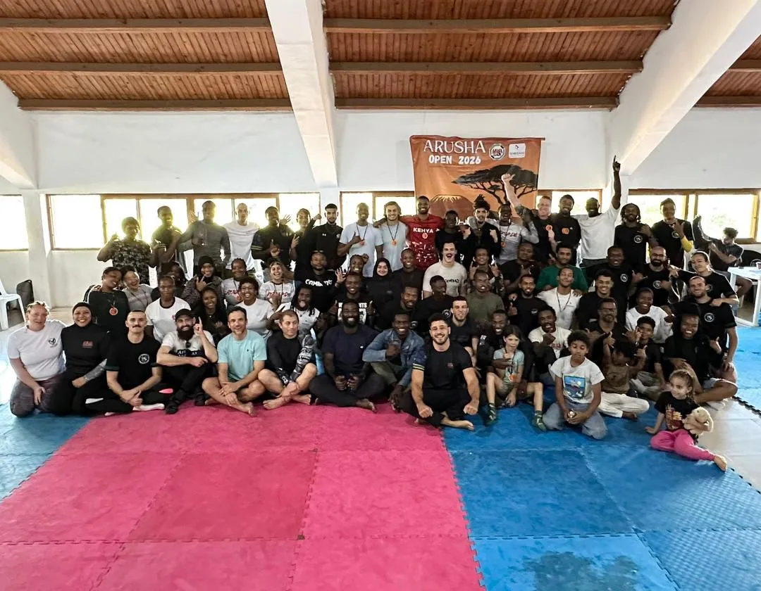 A large group of Brazilian Jiu-Jitsu athletes gathered on the mats