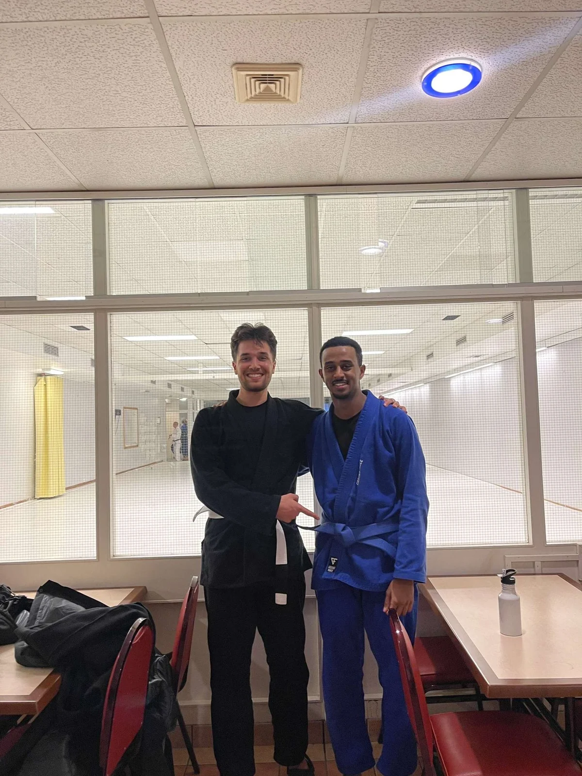 Yobel earns his blue belt at Kigali BJJ