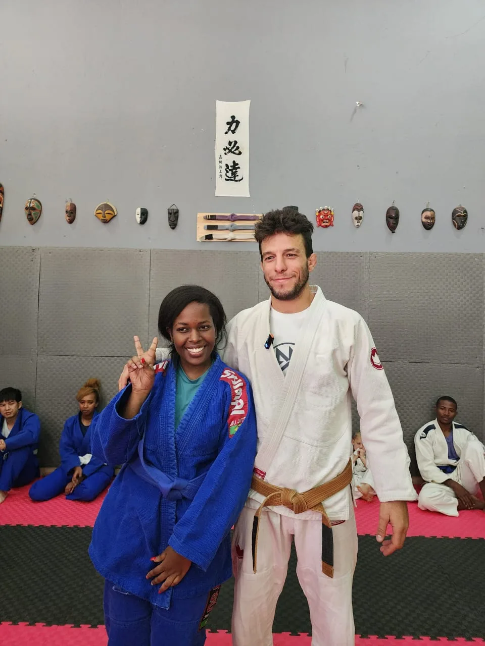 Esther earns her blue belt at Kigali BJJ