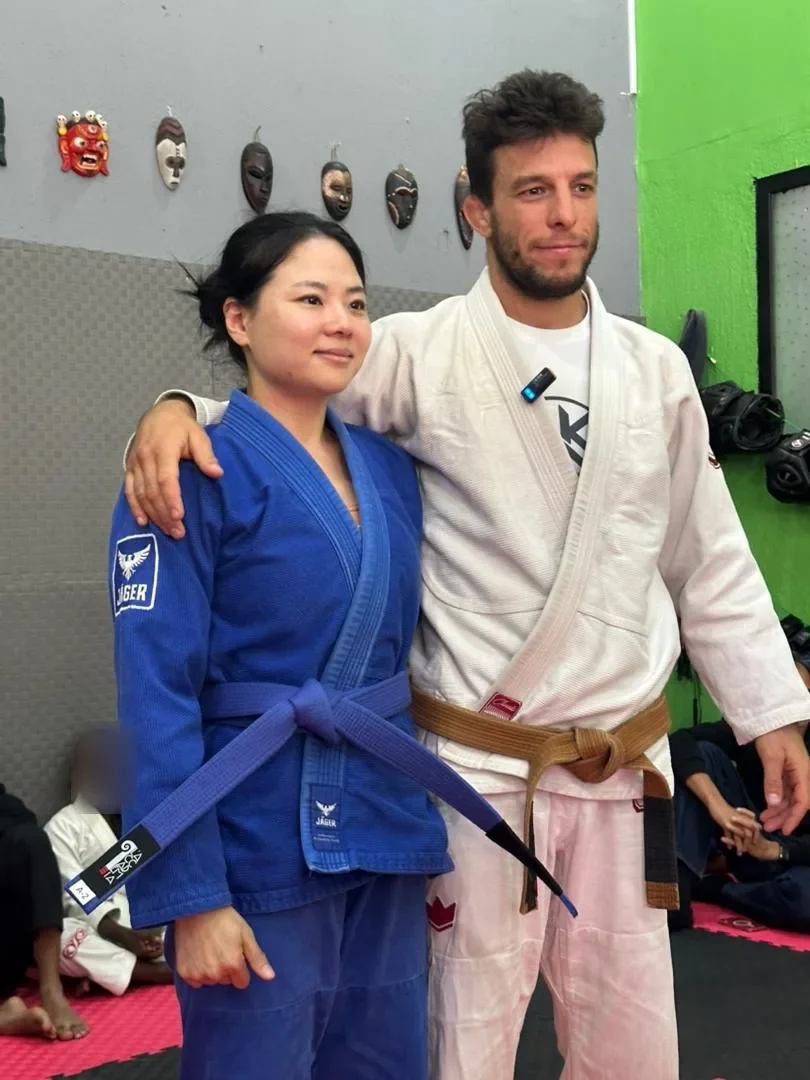 Jun earns her blue belt at Kigali BJJ