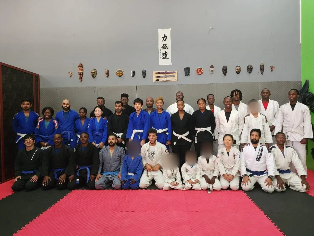Kigali BJJ students gathered for the February 2026 rank promotion event