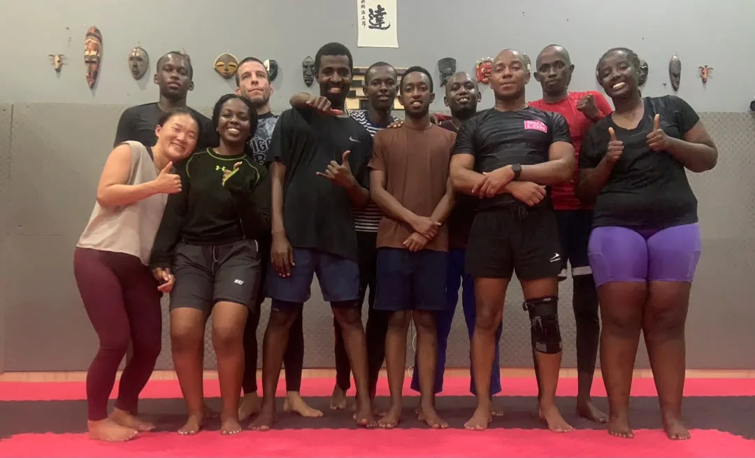 Kigali BJJ no-gi class smiling together after training