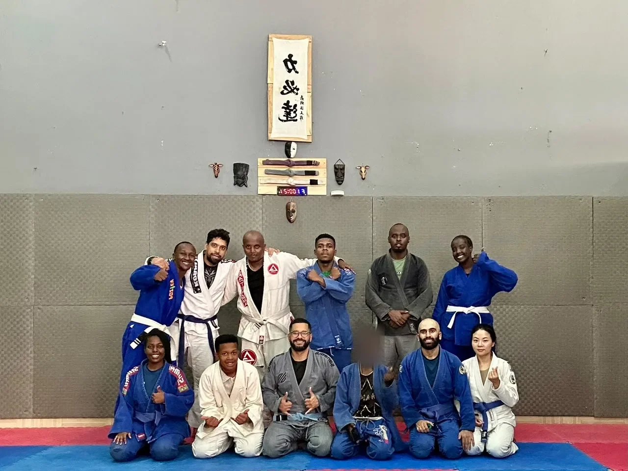 Kigali BJJ class posing together after training