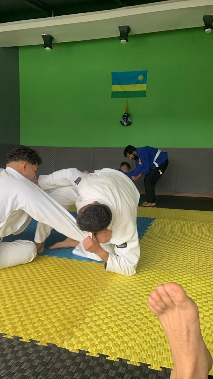 Two Brazilian Jiu-Jitsu students drilling a ground position