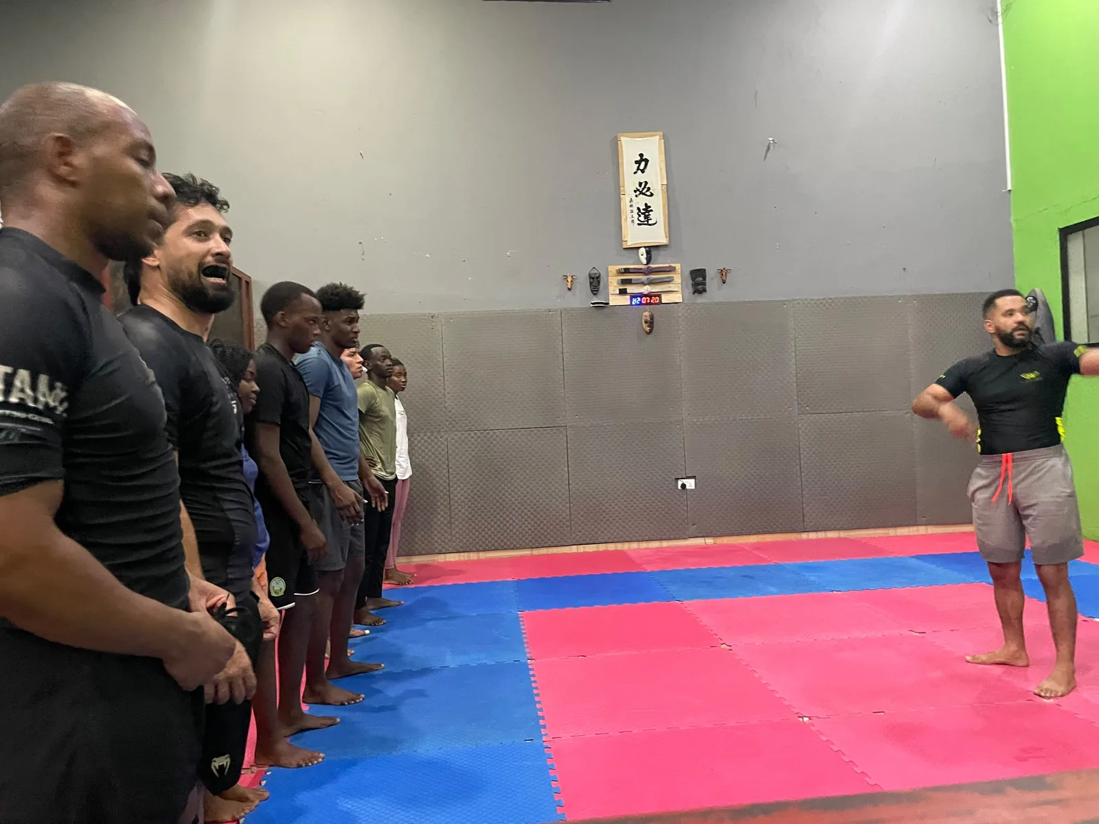 Instruction before rounds at Kigali BJJ